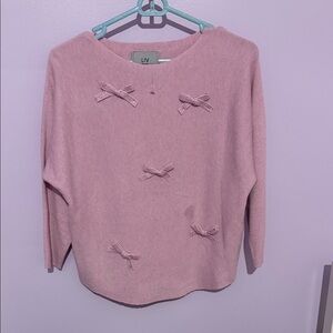 Pink Off-the-Shoulder Sweater with Bow Accents